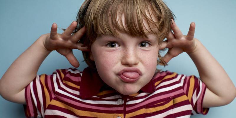 Young Boy making face