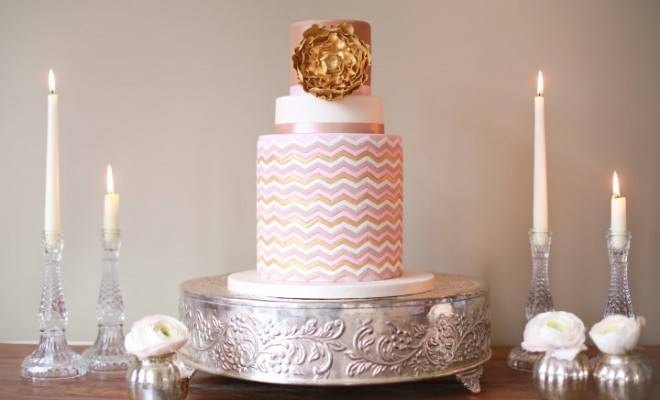 gold-rose-cake-on-silver-stand-and-candle