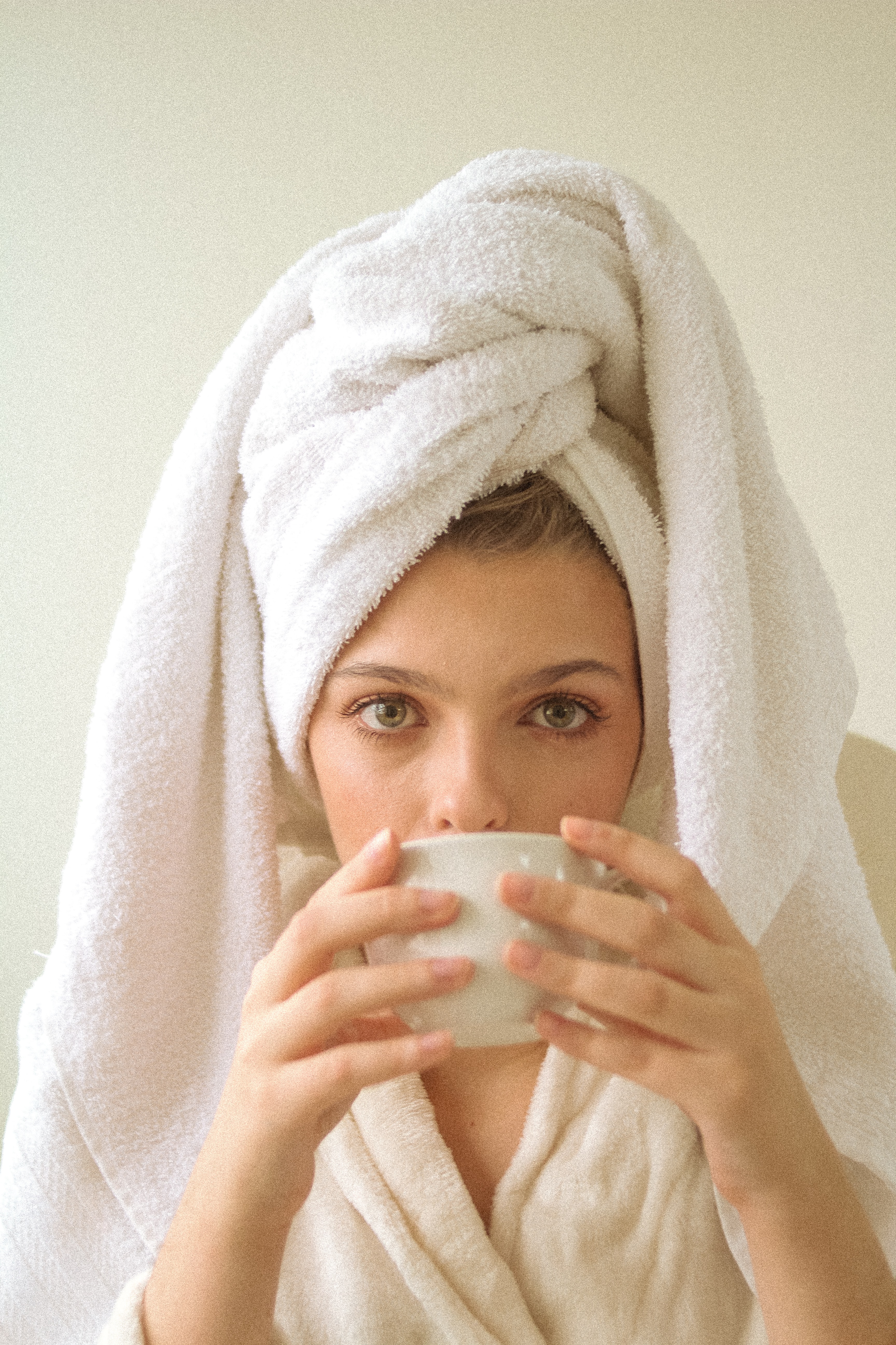 woman covering her body with white towel